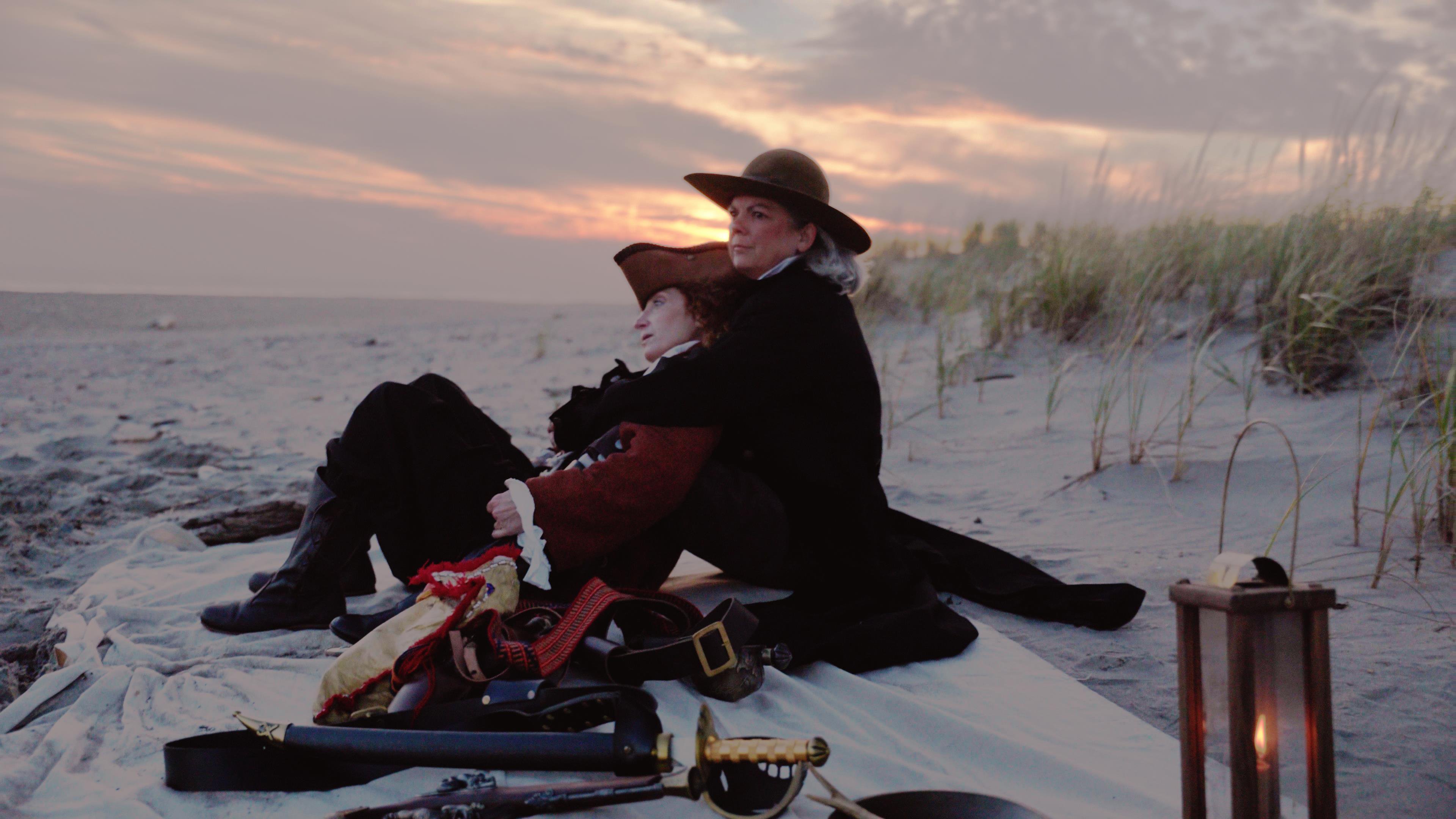 Ann and Charlotte on a deserted beach